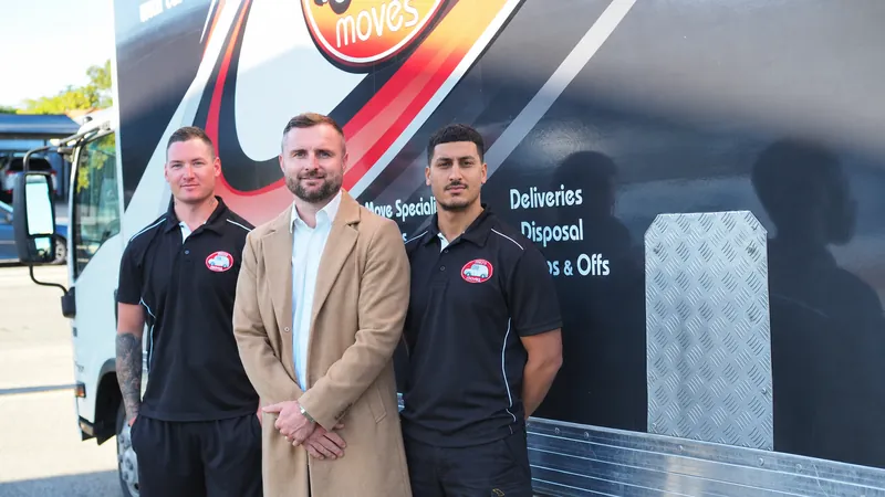 Micro Moves team beside their branded truck